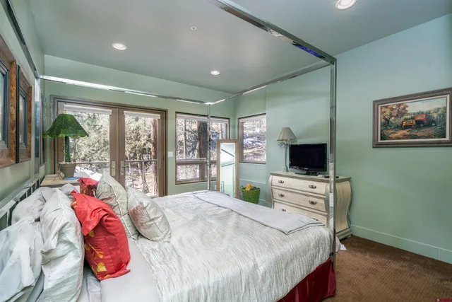 a bathroom with a granite countertop toilet a sink and a bathtub