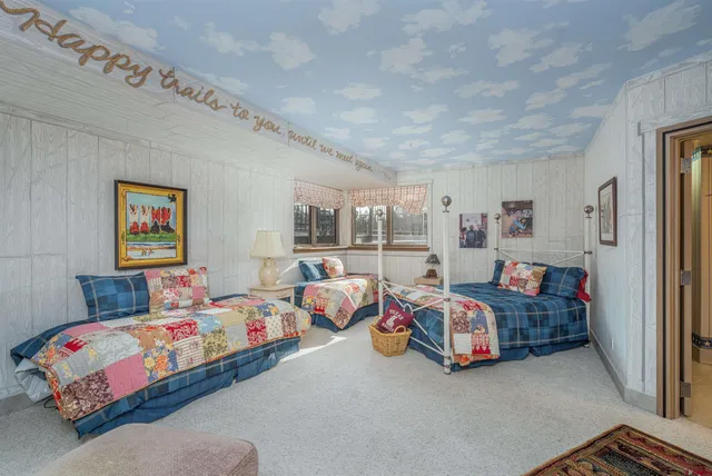 a bathroom with a shower sink vanity and mirror