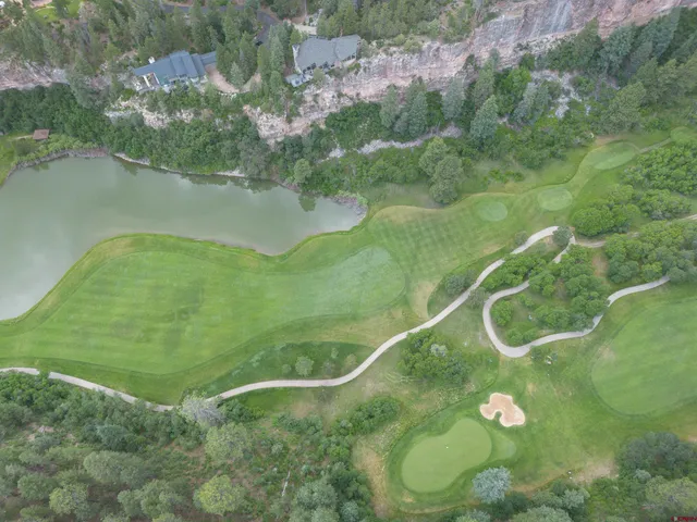 a view of a lake with a yard