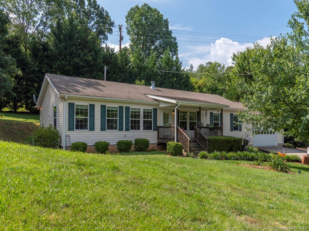 2488 Thickety Road Clyde, NC 28721 - Photo 1 of 25 a view of a house with a yard and sitting area
