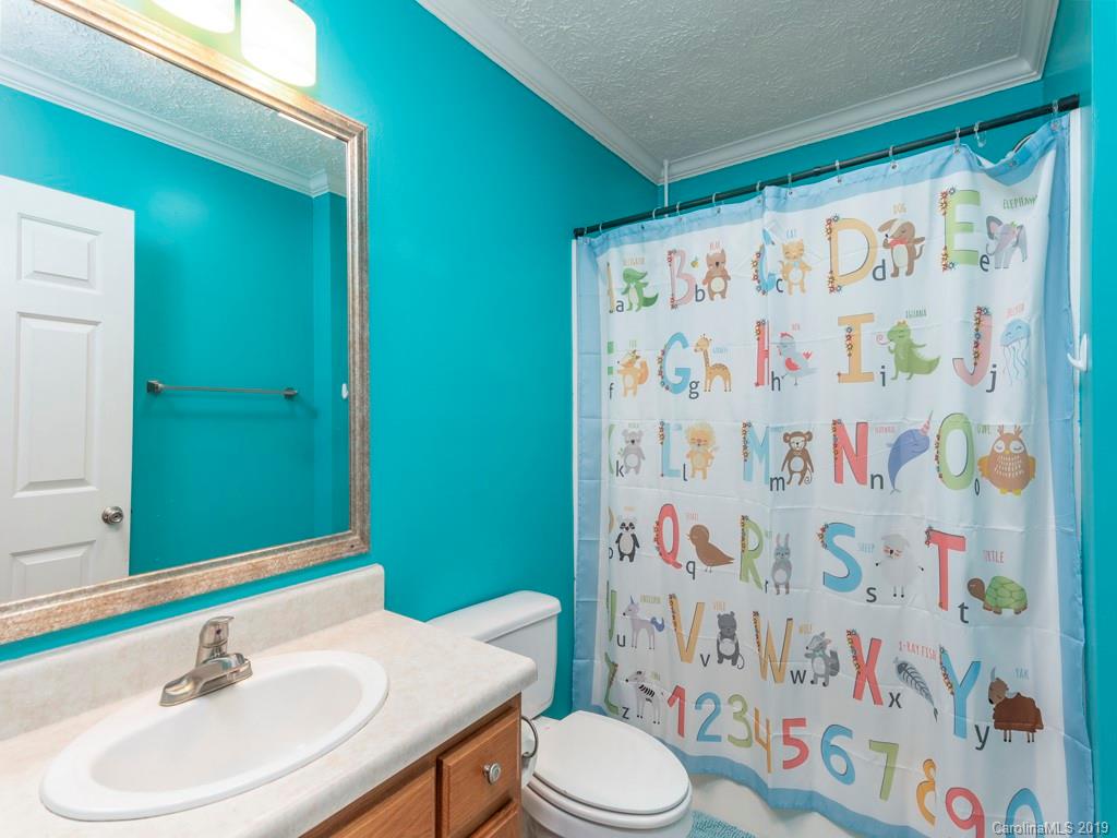 2488 Thickety Road Clyde, NC 28721 - Photo 11 of 25 a bathroom with a sink toilet and a mirror