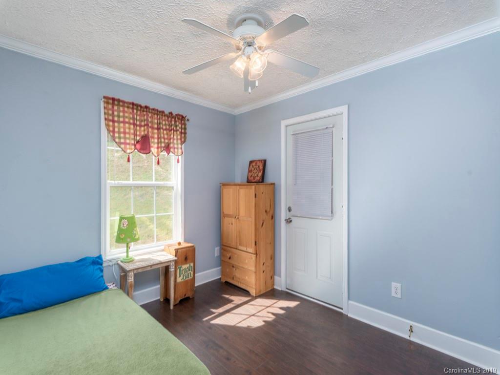 2488 Thickety Road Clyde, NC 28721 - Photo 12 of 25 a living room with furniture and a window