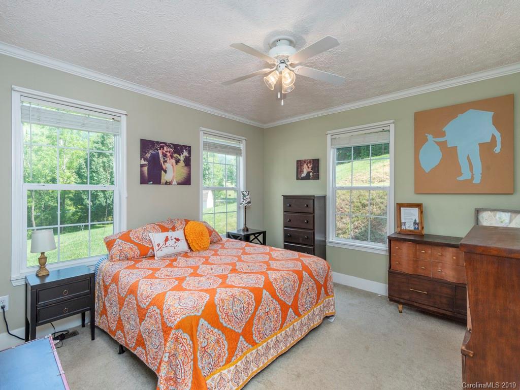 2488 Thickety Road Clyde, NC 28721 - Photo 13 of 25 a bedroom with a bed and window