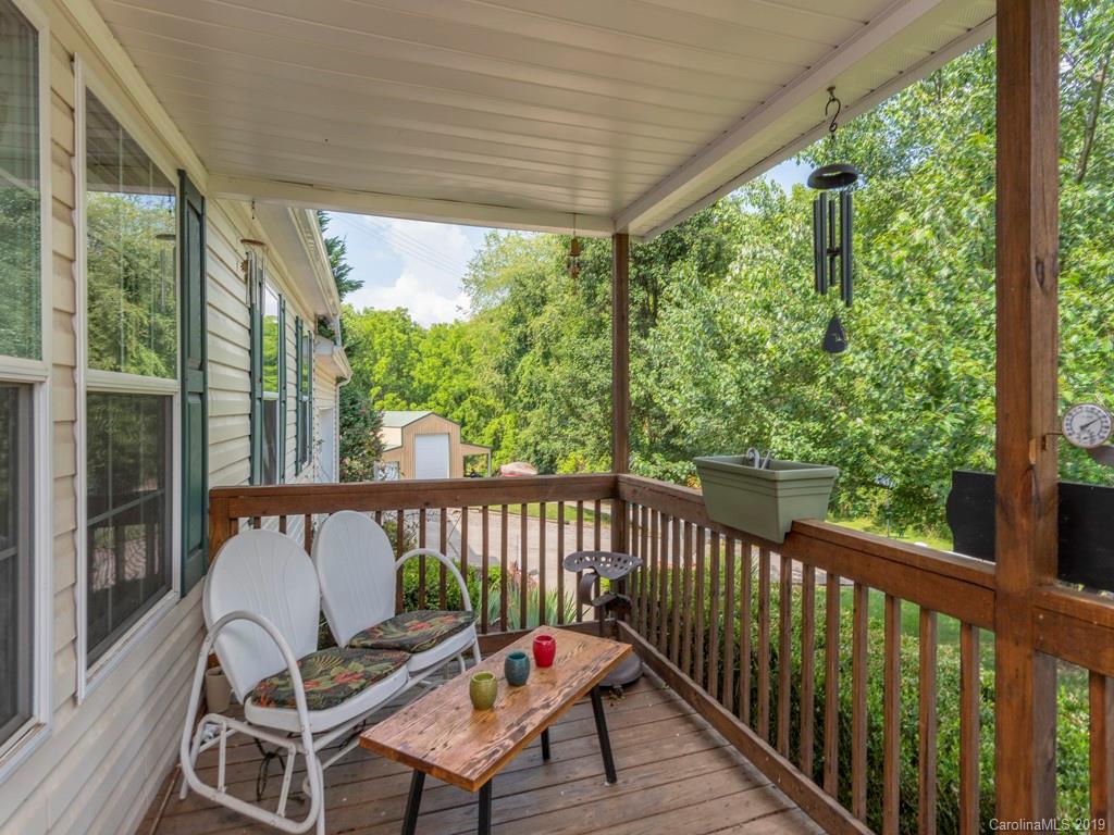 2488 Thickety Road Clyde, NC 28721 - Photo 16 of 25 a view of a chair in wooden deck