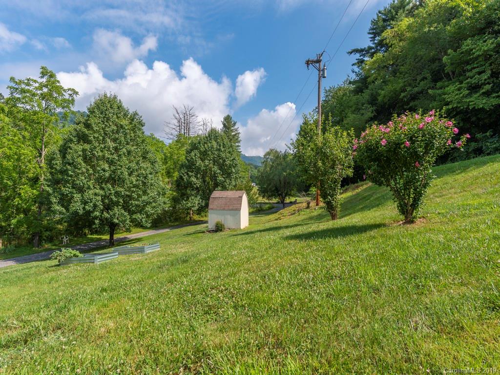 2488 Thickety Road Clyde, NC 28721 - Photo 19 of 25 a house view with a garden space