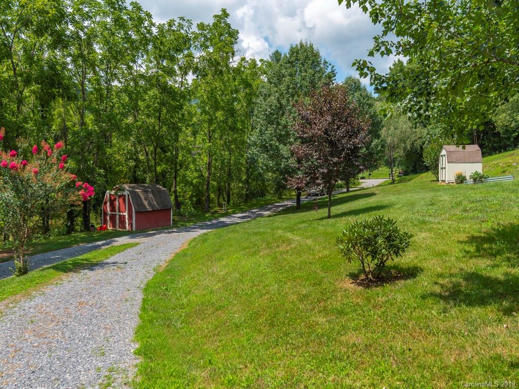 2488 Thickety Road Clyde, NC 28721 - Photo 25 of 25 a front view of a house with a yard and tree s