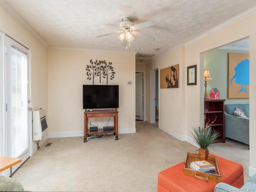 2488 Thickety Road Clyde, NC 28721 - Photo 8 of 25 a living room with furniture and a flat screen tv