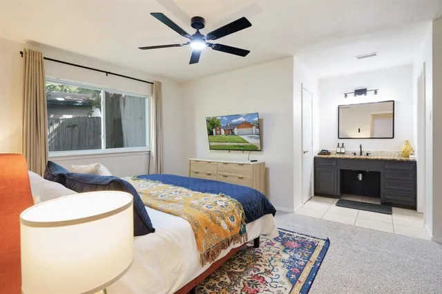 a bedroom with a bed and a dresser