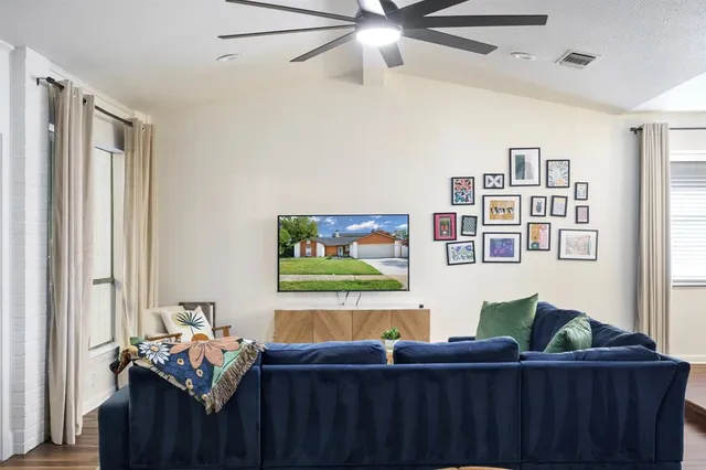 a living room with furniture and a window