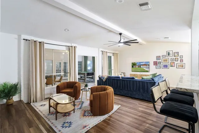 a living room with furniture and a window
