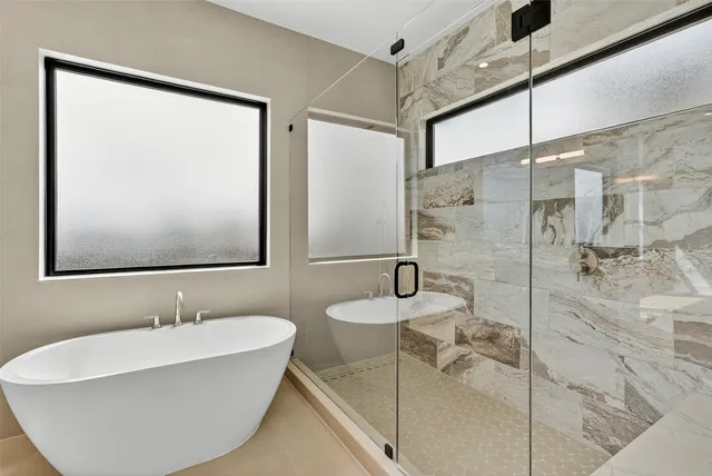 a bathroom with a double vanity sink mirror and