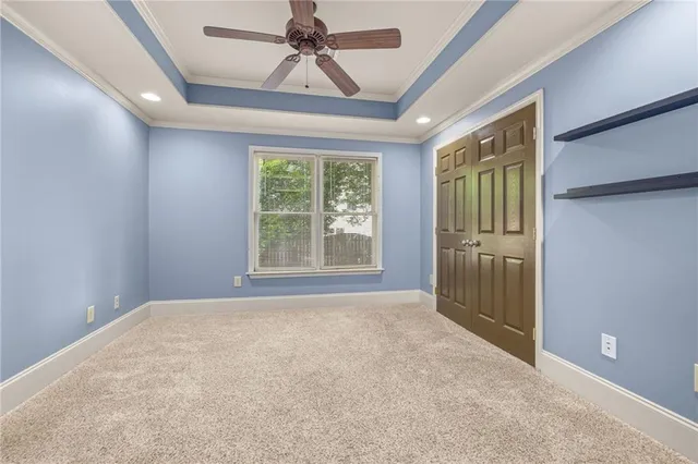 a view of room with window and ceiling fan