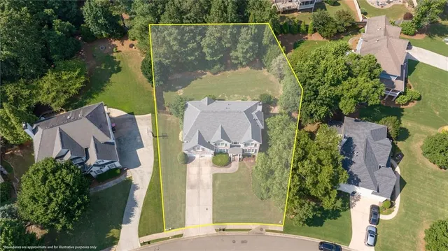 an aerial view of residential house with outdoor space and swimming pool