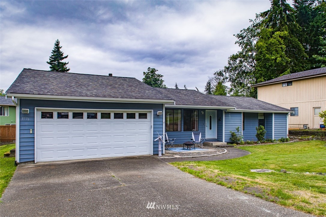 3776 Magrath Road Bellingham, WA 98226 - Photo 1 of 23 a front view of a house with garden