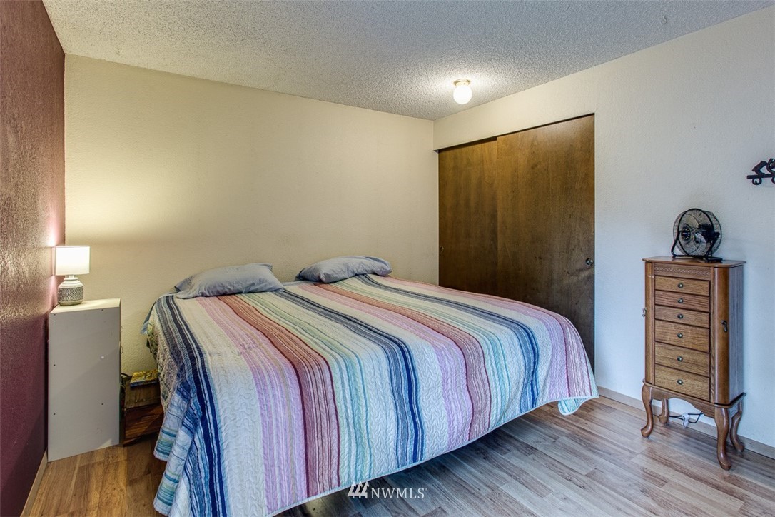 3776 Magrath Road Bellingham, WA 98226 - Photo 14 of 23 a bedroom with a bed and a closet