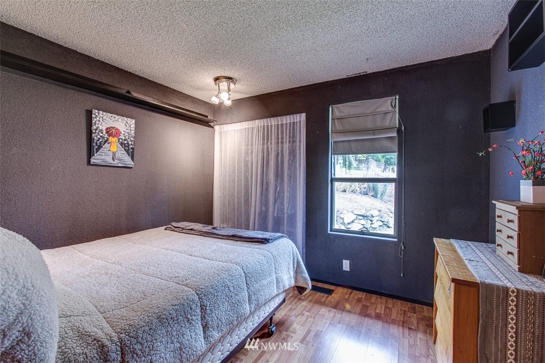 3776 Magrath Road Bellingham, WA 98226 - Photo 16 of 23 a bedroom with a bed and a window