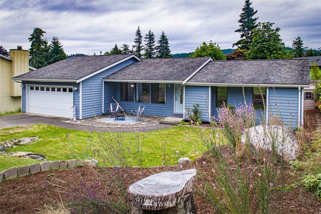 3776 Magrath Road Bellingham, WA 98226 - Photo 3 of 23 a front view of house with yard and outdoor seating