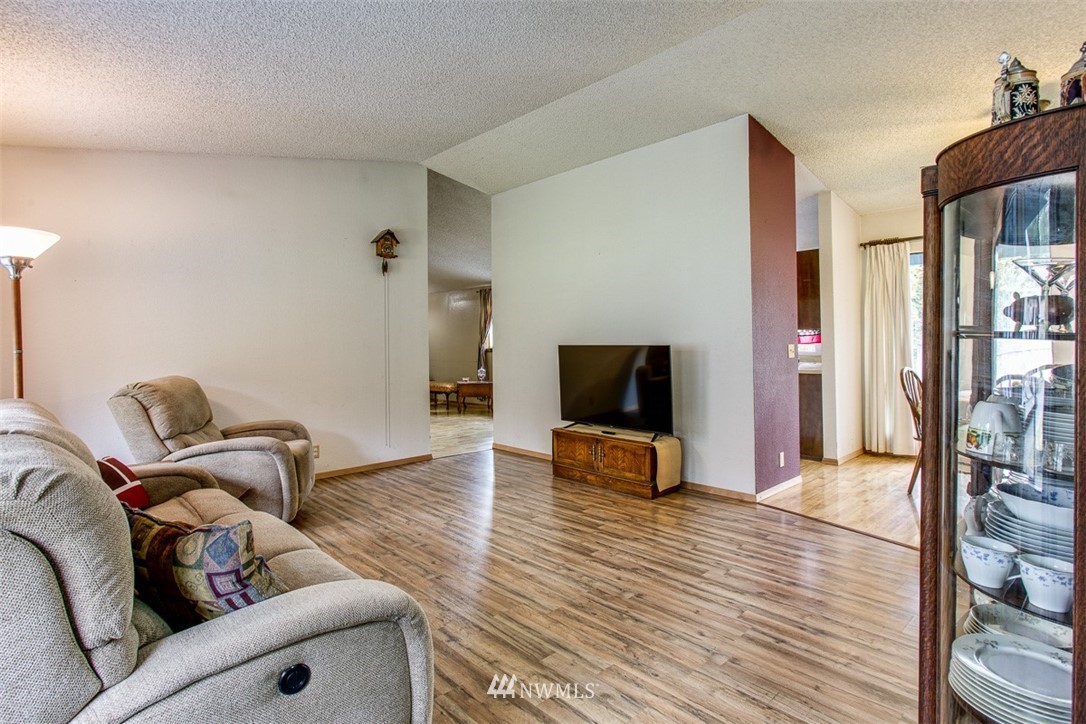 3776 Magrath Road Bellingham, WA 98226 - Photo 6 of 23 a living room with furniture and a flat screen tv