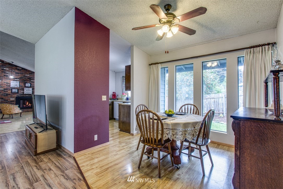 3776 Magrath Road Bellingham, WA 98226 - Photo 7 of 23 a view of a dining room with furniture window and wooden floor