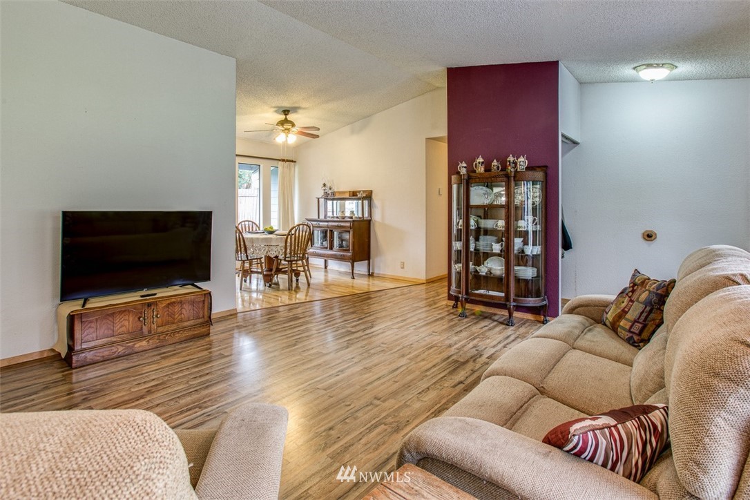 3776 Magrath Road Bellingham, WA 98226 - Photo 8 of 23 a living room with furniture and a flat screen tv