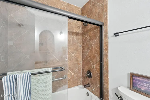 a view of a garage with storage and utility room