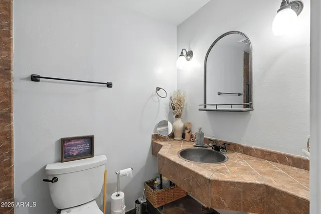 a view of a porch with furniture and a yard