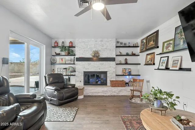 a living room with furniture and a fireplace