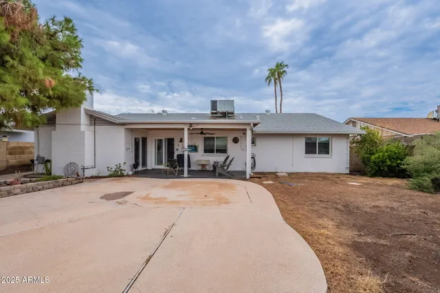 an aerial view of a house with a swimming pool