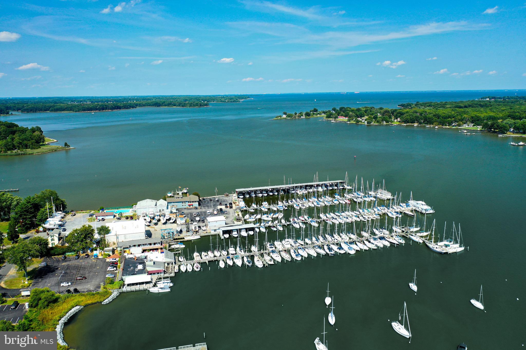 Riverside Drive, Unit C4 Galesville, MD 20765 - Photo 2 of 6 a view of a lake with a city