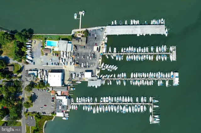 an aerial view of a house with a lake view