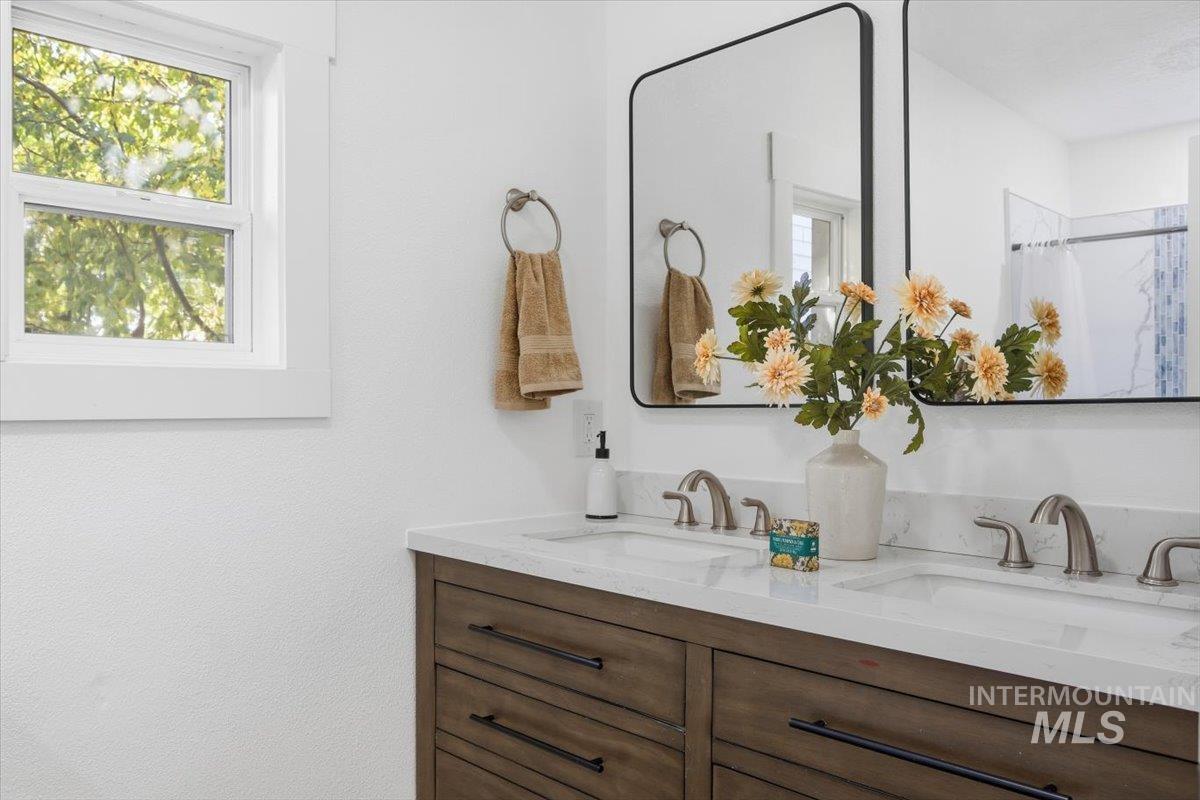1407 South Roosevelt Street Boise, ID 83705 - Photo 20 of 38 Bathroom featuring double vanity and a shower with shower curtain