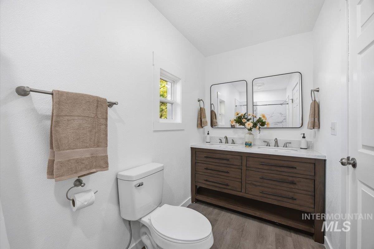 1407 South Roosevelt Street Boise, ID 83705 - Photo 21 of 38 Full bathroom with double vanity and light wood-style floors
