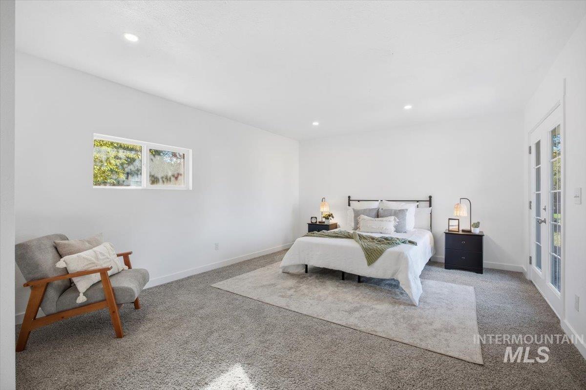 1407 South Roosevelt Street Boise, ID 83705 - Photo 25 of 38 Bedroom featuring carpet flooring, multiple windows, and recessed lighting
