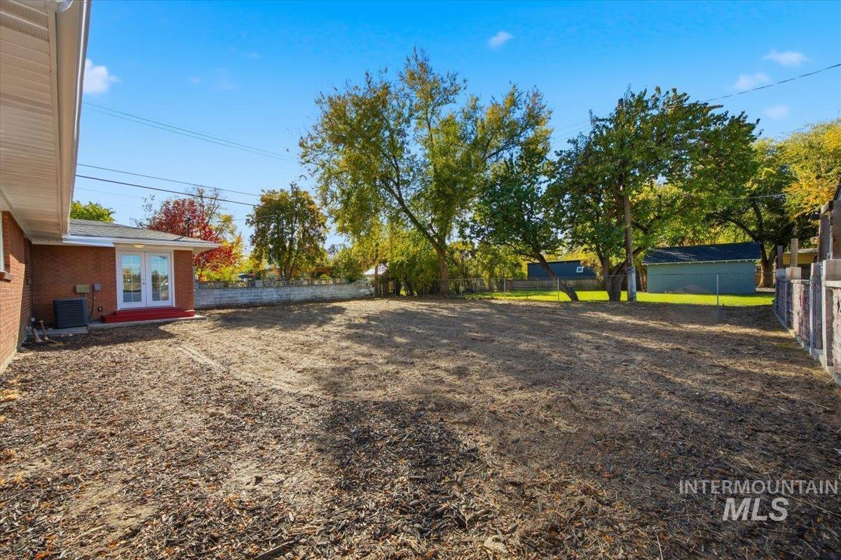 1407 South Roosevelt Street Boise, ID 83705 - Photo 37 of 38 Fenced backyard featuring french doors