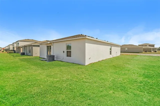 a view of a house with a big yard
