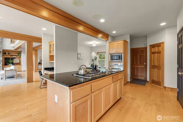 a kitchen with stainless steel appliances granite countertop a sink and cabinets