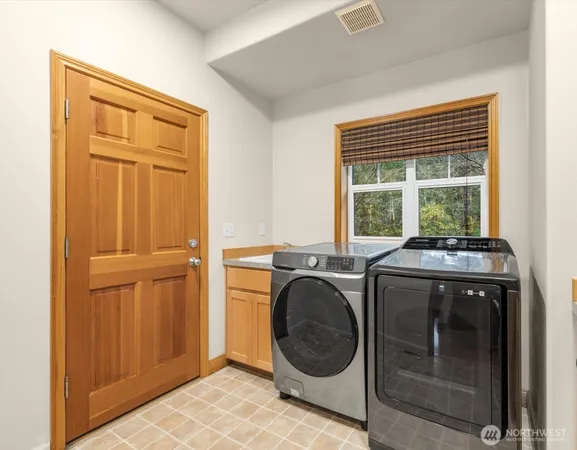 a view of a sink and cabinets in a room