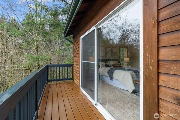 a balcony with view of swimming pool