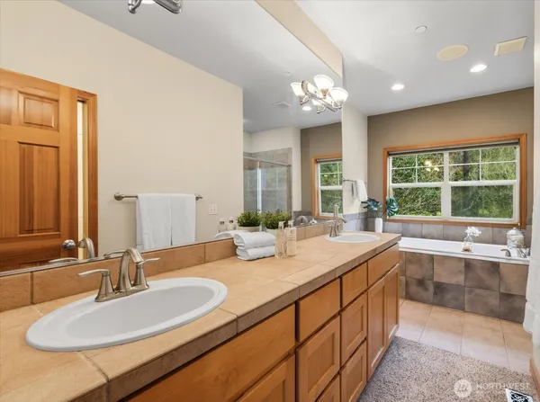 a bathroom with a sink double vanity and a mirror