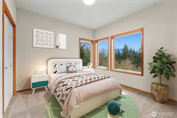 a bedroom with a bed and a potted plant