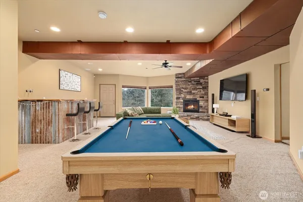a room with lots of furniture and a large window
