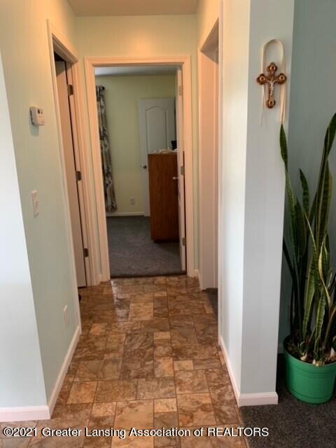 4050 Matthews Road Charlotte, MI 48813 - Photo 17 of 35 Hallway to Bedrooms 2 & 3 and Bathroom 2