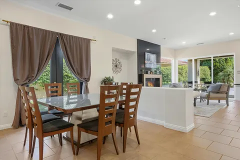 a view of a dining room with furniture window and outside view