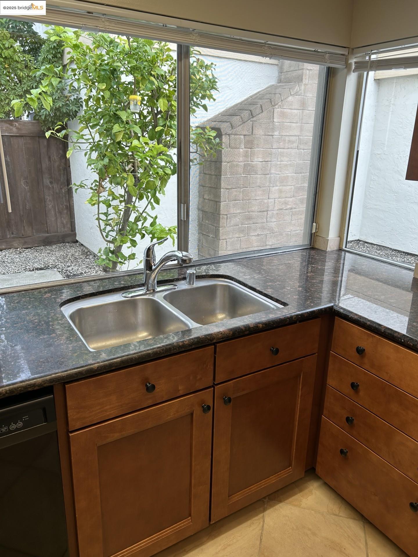 1363 Ridgecrest Road Pinole, CA 94564 - Photo 13 of 37 a kitchen with granite countertop a sink and a window