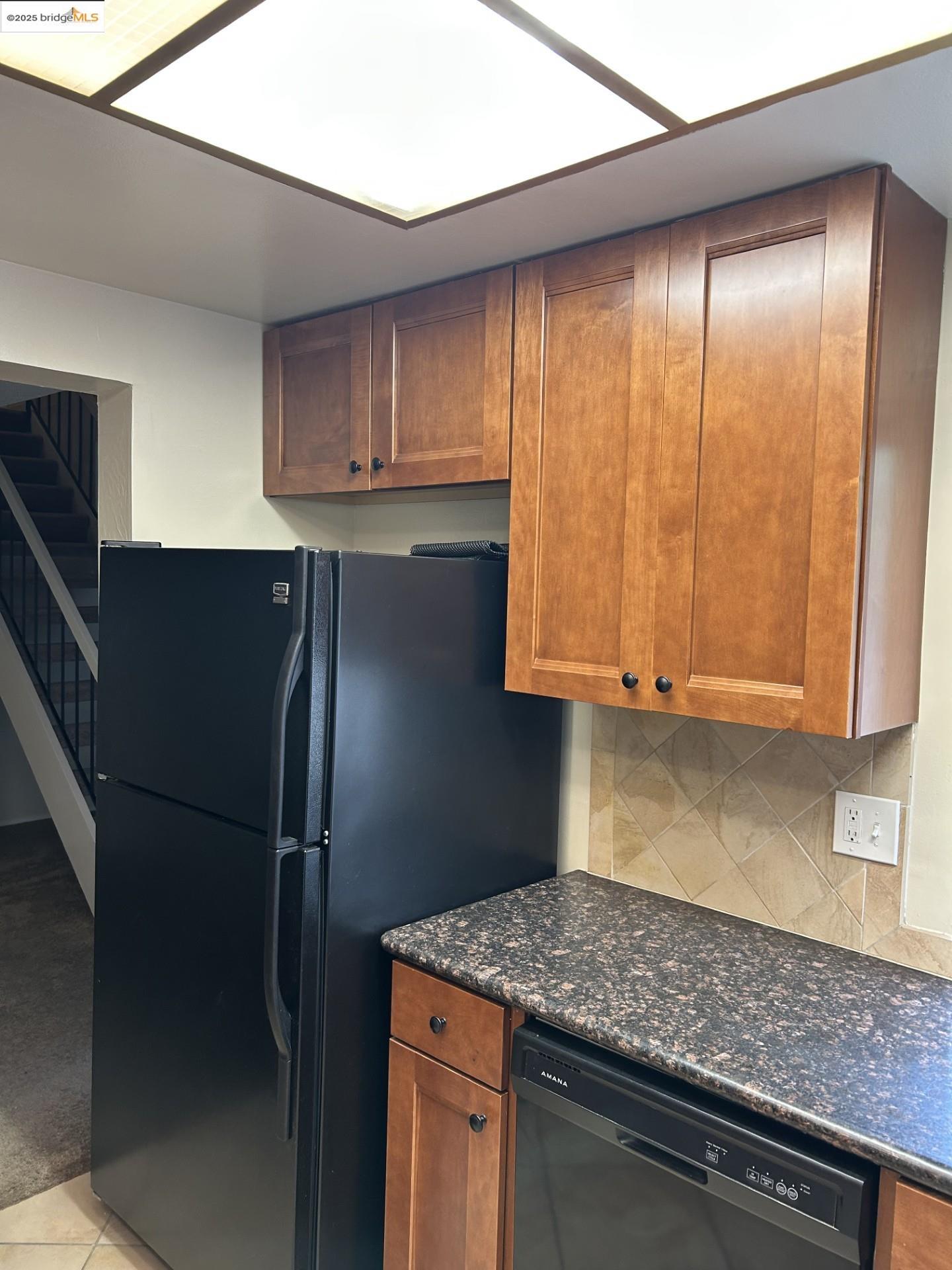 1363 Ridgecrest Road Pinole, CA 94564 - Photo 16 of 37 a kitchen with stainless steel appliances granite countertop a refrigerator and a sink