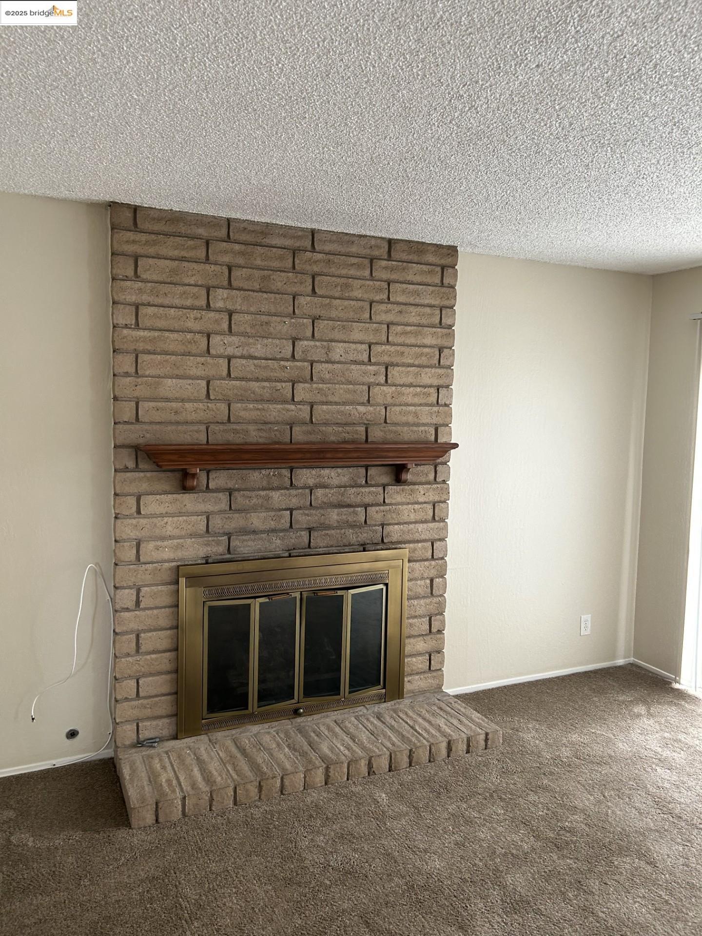 1363 Ridgecrest Road Pinole, CA 94564 - Photo 29 of 37 a view of an empty room with a fireplace