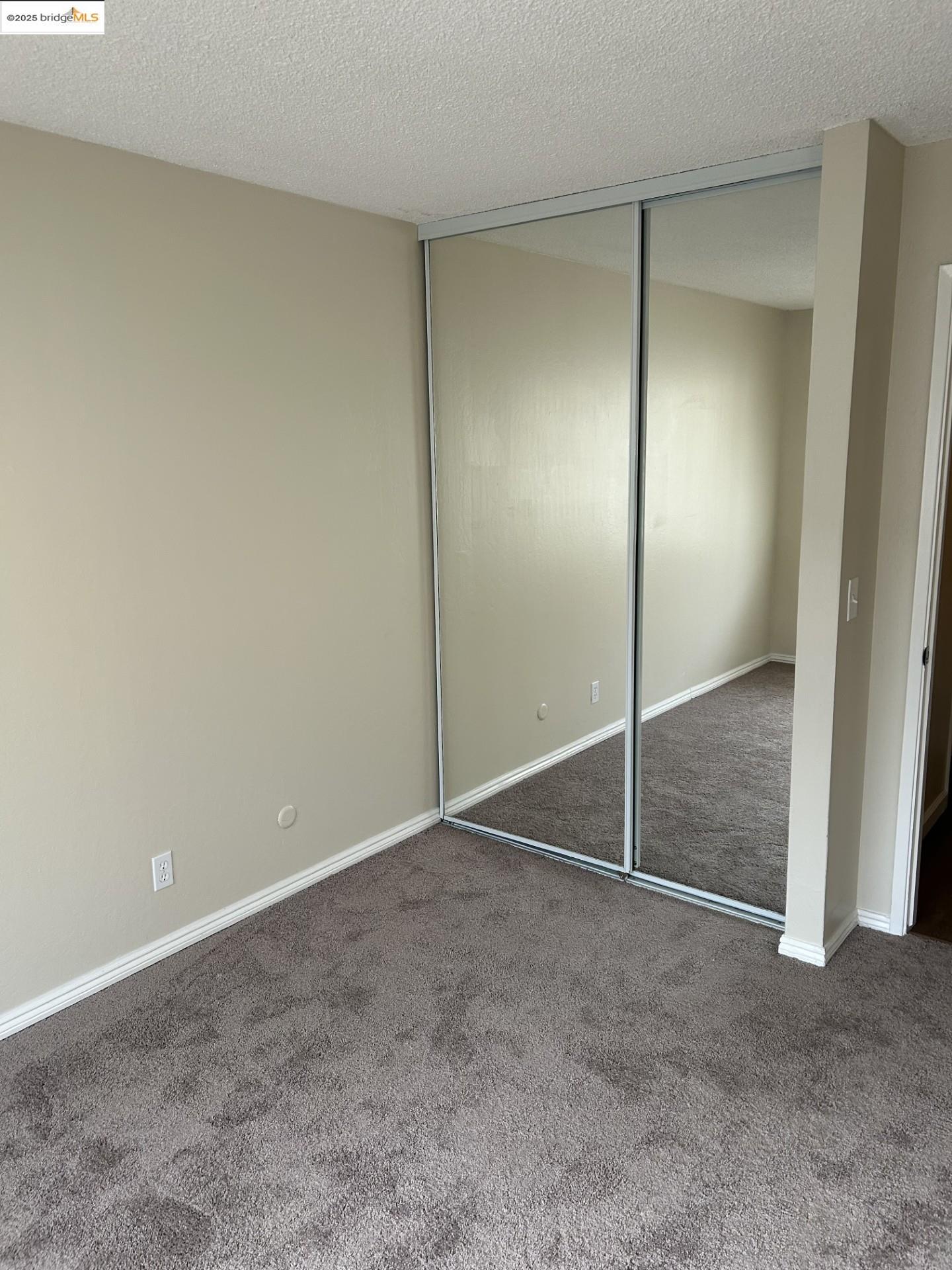 1363 Ridgecrest Road Pinole, CA 94564 - Photo 32 of 37 an empty room with closet and door