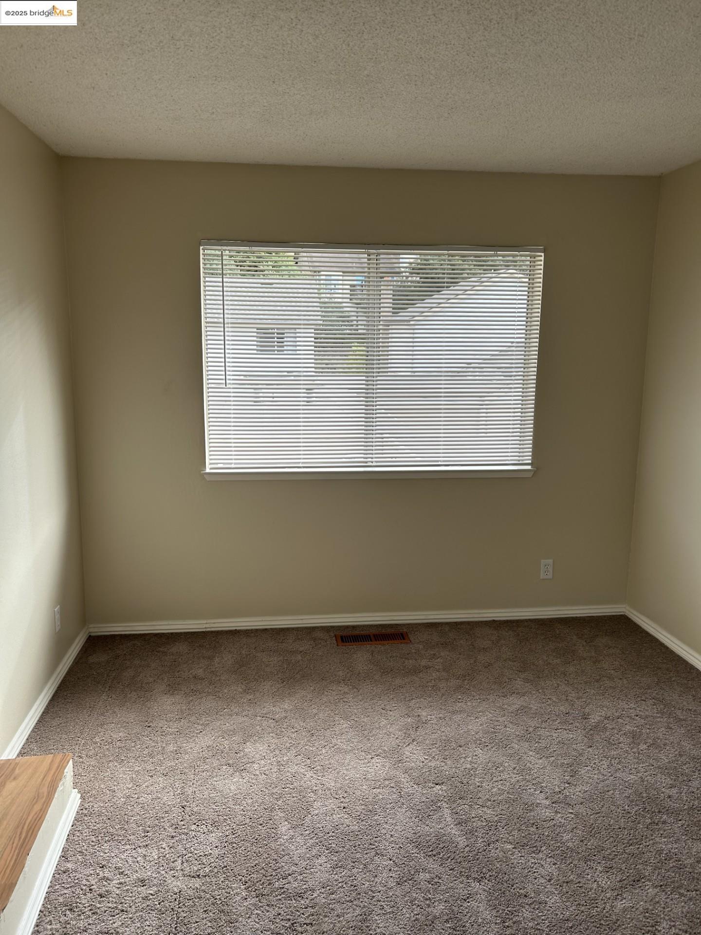 1363 Ridgecrest Road Pinole, CA 94564 - Photo 33 of 37 an empty room with a window