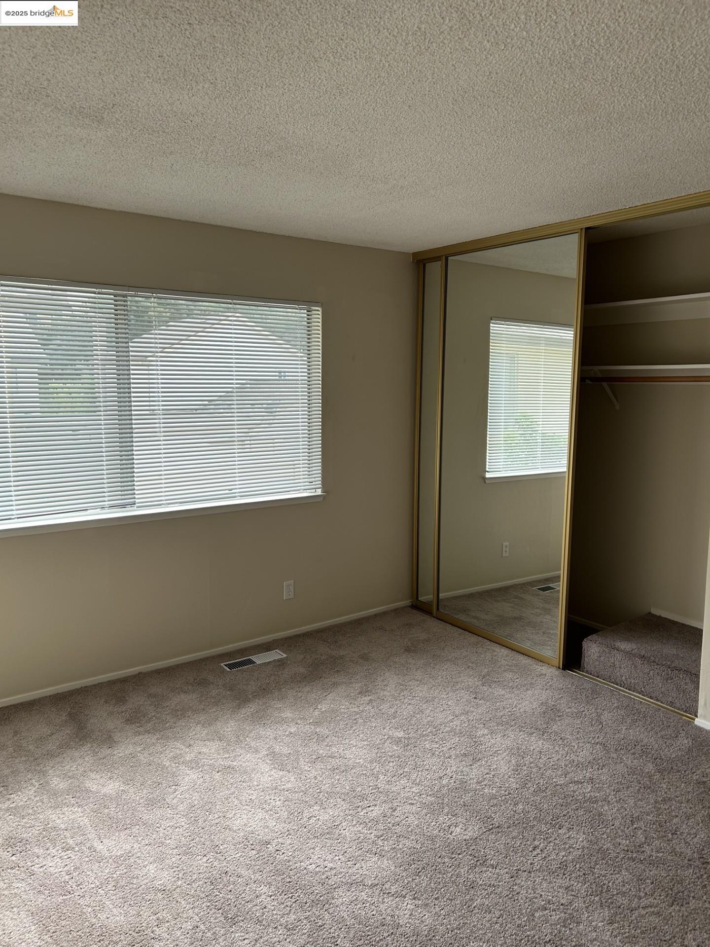 1363 Ridgecrest Road Pinole, CA 94564 - Photo 35 of 37 an empty room with windows