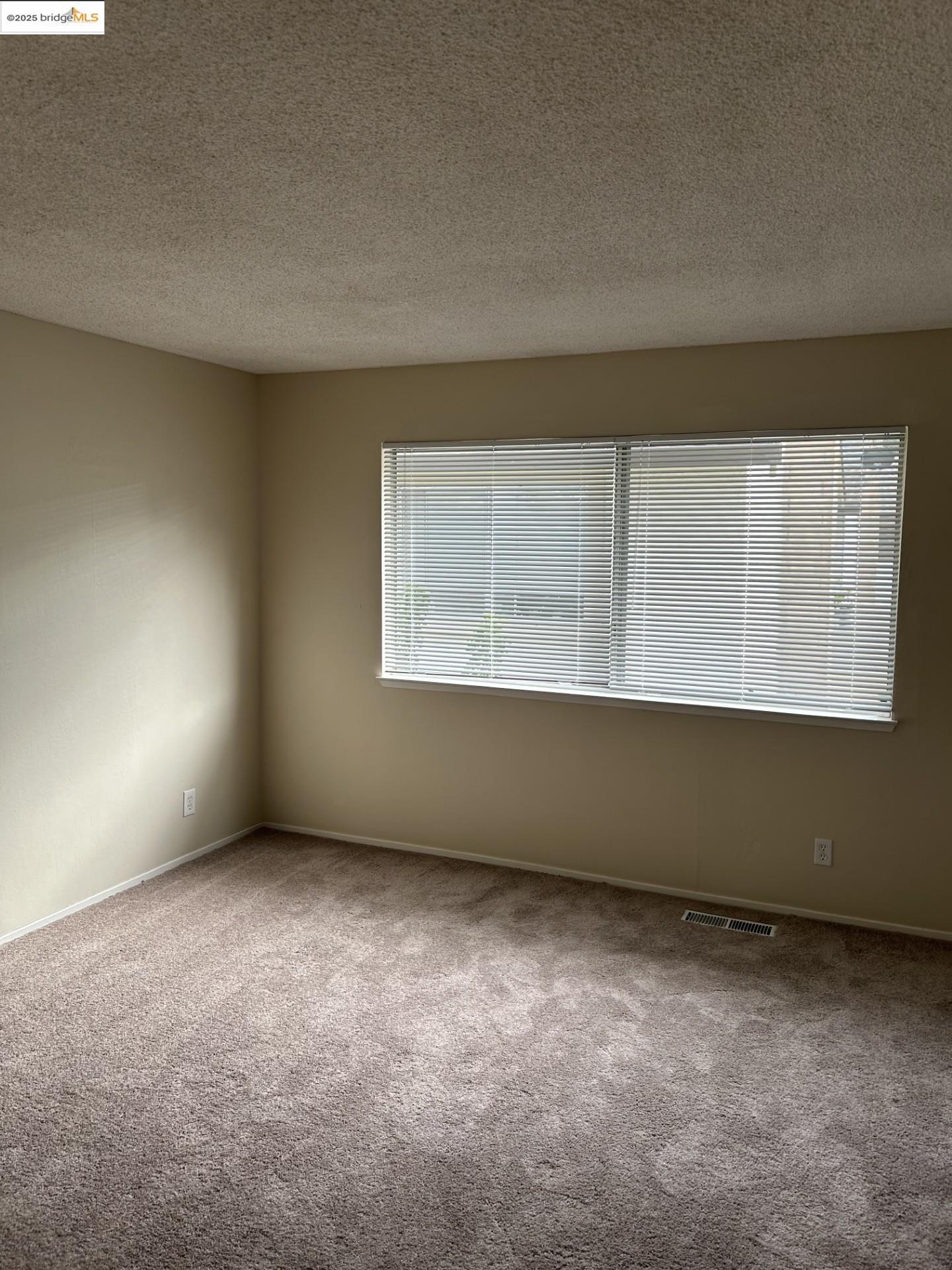 1363 Ridgecrest Road Pinole, CA 94564 - Photo 36 of 37 an empty room with a window